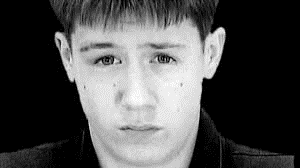 Black and white photo of a Caucasian young male.