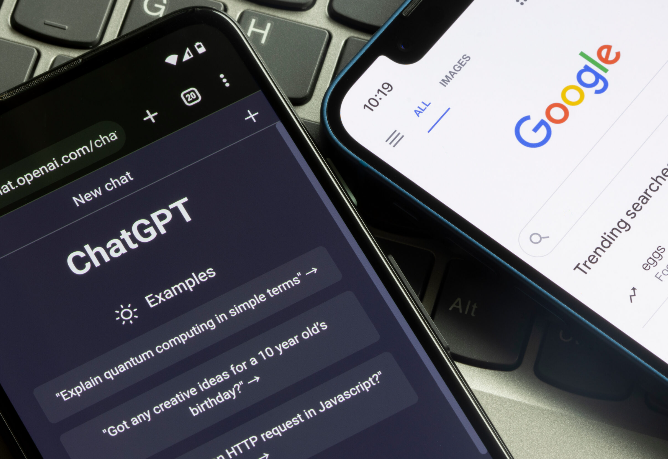 Two smartphones displayed on a laptop keyboard, with one showing the ChatGPT interface and the other displaying the Google search homepage.