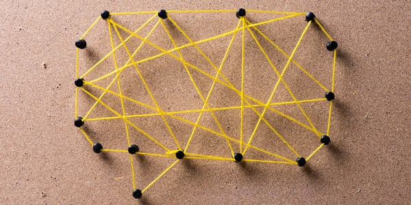 comment bubble showing push pins with yellow string connecting push pins in overlapping connections